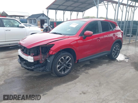2016 Mazda CX-5 Grand Touring with VIN JM3KE4DY9G0865780, listed as a IAAI auction lot 41913914 with 76,579 mi miles. Bid and sale history available at carsss.com. Image 20.