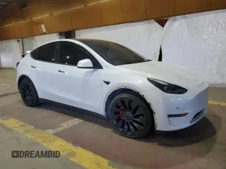 2022 Tesla Model Y Performance with VIN 7SAYGDEF7NF520825, listed as a Copart auction lot 57400245 with 55,437 mi miles and Salvage title. Bid and sale history available at DreamBid. Image 4.