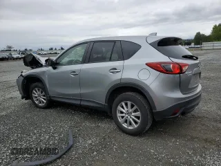 2014 Mazda CX-5 Touring z VIN JM3KE4CYXE0426408, wystawiony jako Copart lot #57355115 z przebiegiem Nie podano mil oraz Szkody całkowita. Historia ofert i sprzedaży dostępna na DreamBid. Obrazek 2.