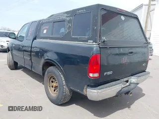 1999 Ford F-150 XL with VIN 1FTRX18L8XNB25526, listed as a IAAI auction lot 41970764 with 1 mi miles. Bid and sale history available at carsss.com. Image 3.