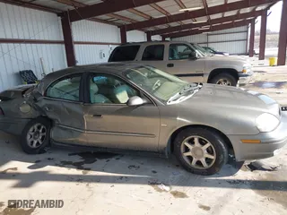 2003 Mercury Sable LS Premium with VIN 1MEFM55S43A631966, listed as a IAAI auction lot 41408623 with 130,010 mi miles. Bid and sale history available at carsss.com. Image 13.