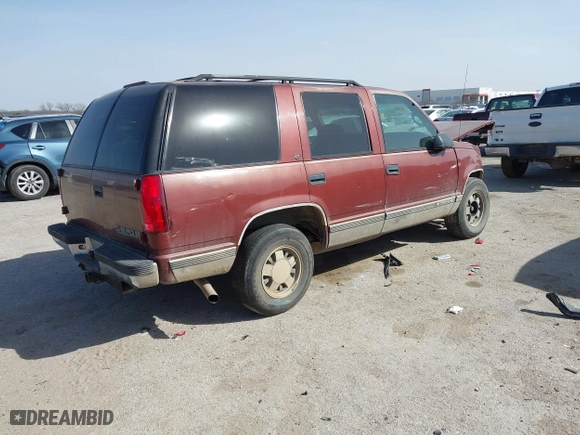 1999 Chevrolet Tahoe with VIN 1GNEC13R9XJ341261, listed as a IAAI auction lot 41741710 with 234,676 mi miles. Bid and sale history available at carsss.com. Image 4.
