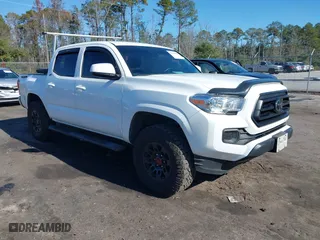 2023 Toyota Tacoma 4WD SR with VIN 3TMCZ5ANXPM543308, listed as a IAAI auction lot 41160979 with 68,101 mi miles. Bid and sale history available at carsss.com. Image 1.