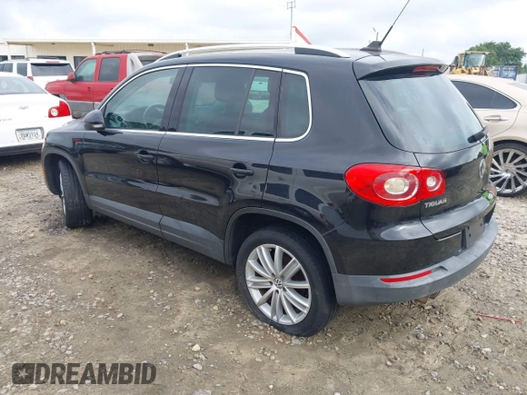 2011 Volkswagen Tiguan SEL with VIN WVGBV7AX6BW521525, listed as a IAAI auction lot 42490216 with 123,546 mi miles and . Bid and sale history available at DreamBid. Image 3.