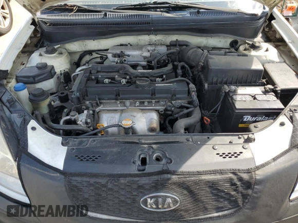 2009 Kia Rio LX with VIN KNADE223X96439445, listed as a Copart auction lot 54619335 with 102,120 mi miles and Salvage Title. Bid and sale history available at DreamBid. Image 11.