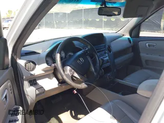 2015 Honda Pilot Touring with VIN 5FNYF3H92FB020766, listed as a IAAI auction lot 41983315 with 201,086 mi miles. Bid and sale history available at carsss.com. Image 5.