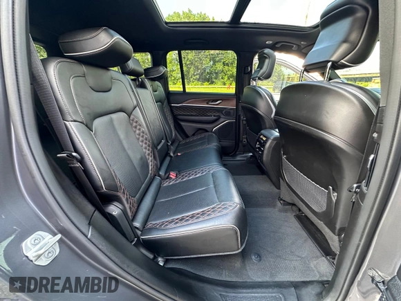 2023 Jeep Grand Cherokee Summit with VIN 1C4RJHEG2P8882566, listed as a Copart auction lot 65095905 with 59,970 mi miles and Salvage title. Bid and sale history available at DreamBid. Image 6.