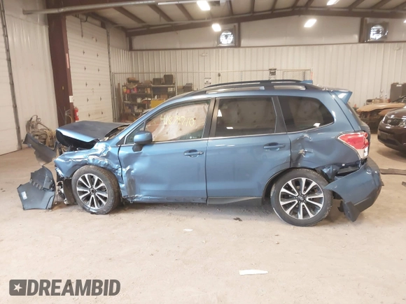 2018 Subaru Forester Premium with VIN JF2SJGECXJH606668, listed as a IAAI auction lot 41879710 with 64,910 mi miles. Bid and sale history available at carsss.com. Image 14.