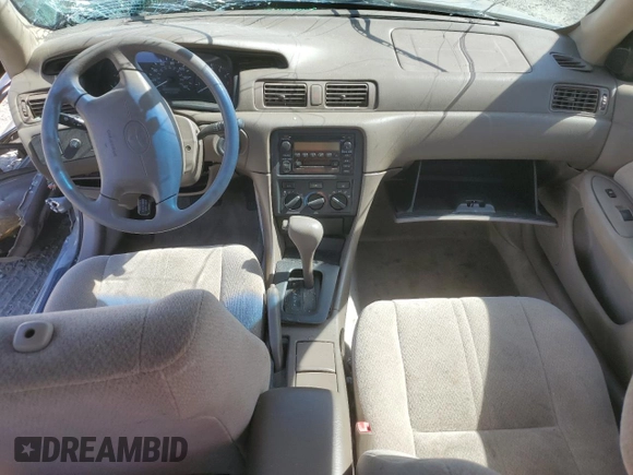2001 Toyota Camry CE z VIN JT2BG22K410568101, wystawiony jako Copart lot #57184125 z przebiegiem Nie podano mil oraz Szkoda całkowita • Salvage title. Historia ofert i sprzedaży dostępna na DreamBid. Obrazek 8.