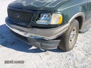2003 Ford F-150 XLT with VIN 1FTRW07L53KA64064, listed as a IAAI auction lot 41697350 with 227,114 mi miles. Bid and sale history available at carsss.com. Image 6.