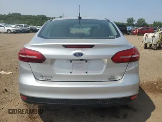 2017 Ford Focus SE with VIN 1FADP3FE7HL290271, listed as a Copart auction lot 60665615 with 130,409 mi miles and Salvage title. Bid and sale history available at DreamBid. Image 6.
