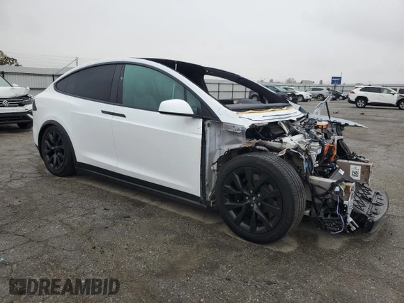 2023 Tesla Model X with VIN 7SAXCAE58PF379943, listed as a Copart auction lot 86352354 with Not Provided miles and Salvage Title. Bid and sale history available at DreamBid. Image 4.