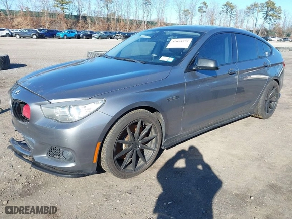 2011 BMW 5 Series Gran Turismo 550i xDrive with VIN WBASP4C52BC341644, listed as a IAAI auction lot 41694573 with 202,983 mi miles. Bid and sale history available at carsss.com. Image 2.