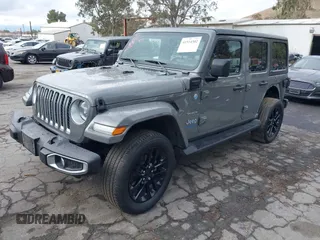 2021 Jeep Wrangler Unlimited Sahara with VIN 1C4JJXP64MW720263, listed as a IAAI auction lot 41514302 with 73,300 mi miles and . Bid and sale history available at DreamBid. Image 18.