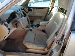 1998 Mercedes-Benz E-Class with VIN WDBJH65F9WA597132, listed as a Copart auction lot 77780094 with 0 mi miles and Salvage Title. Bid and sale history available at carsss.com. Image 7.