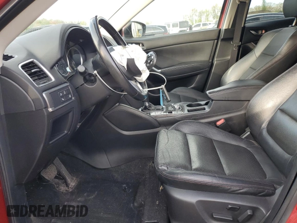 2016 Mazda CX-5 Grand Touring with VIN JM3KE4DY6G0753826, listed as a Copart auction lot 55391555 with 96,852 mi miles and Salvage Title. Bid and sale history available at DreamBid. Image 7.