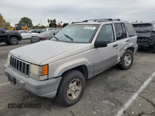 1997 Jeep Grand Cherokee Laredo with VIN 1J4GZ58S0VC771727, listed as a Copart auction lot 82233224 with 320,213 mi miles and Salvage Title. Bid and sale history available at carsss.com. Image 1.