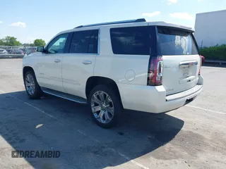 2015 GMC Yukon Denali with VIN 1GKS1CKJ3FR230797, listed as a IAAI auction lot 41977294 with 174,633 mi miles. Bid and sale history available at carsss.com. Image 3.