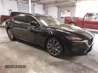 2018 Mazda 6 Grand Touring with VIN JM1GL1TY0J1316281, listed as a IAAI auction lot 41376895 with 112,464 mi miles and . Bid and sale history available at DreamBid. Image 1.
