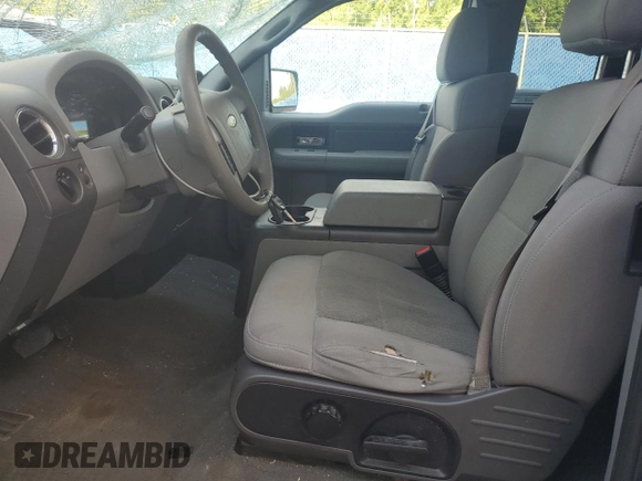 2006 Ford F-150 STX with VIN 1FTRX12W16NA23681, listed as a Copart auction lot 61585435 with 197,243 mi miles and Salvage title. Bid and sale history available at DreamBid. Image 7.
