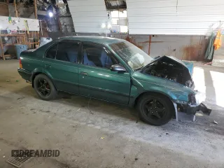 1996 Toyota Tercel DX z VIN JT2BC52L7T7044201, wystawiony jako Copart lot #77190074 z przebiegiem Nie podano mil oraz Szkoda całkowita • Salvage title. Historia ofert i sprzedaży dostępna na DreamBid. Obrazek 4.