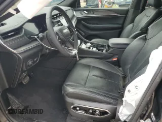 2023 Jeep Grand Cherokee Overland with VIN 1C4RJHDG0PC670537, listed as a Copart auction lot 56757285 with 24,735 mi miles and Salvage title. Bid and sale history available at DreamBid. Image 7.