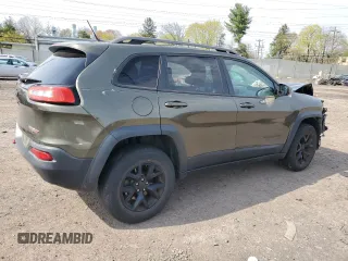 2015 Jeep Cherokee Trailhawk with VIN 1C4PJMBSXFW687205, listed as a Copart auction lot 53128545 with 86,876 mi miles and Salvage Title. Bid and sale history available at carsss.com. Image 3.