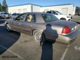 2005 Ford Crown Victoria LX with VIN 2FAFP74W75X129929, listed as a Copart auction lot 89020125 with 156,115 mi miles and Salvage Title. Bid and sale history available at carsss.com. Image 2.