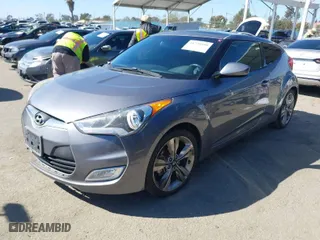 2016 Hyundai Veloster with VIN KMHTC6AD8GU296991, listed as a IAAI auction lot 41720599 with 108,121 mi miles. Bid and sale history available at carsss.com. Image 2.