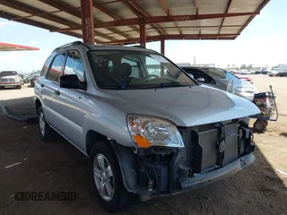 2009 Kia Sportage LX with VIN KNDJF724297601801, listed as a IAAI auction lot 42063474 with 87,869 mi miles. Bid and sale history available at carsss.com. Image 1.