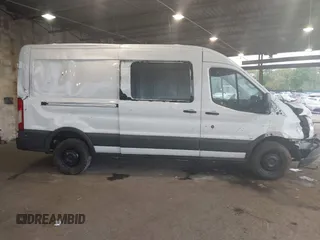2015 Ford Transit Cargo z VIN 1FTNR2CM1FKA40154, wystawiony jako IAAI lot #42210986 z przebiegiem 164 324 mil mil oraz . Historia ofert i sprzedaży dostępna na DreamBid. Obrazek 13.