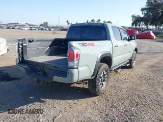 2022 Toyota Tacoma SR with VIN 3TMCZ5AN7NM501028, listed as a IAAI auction lot 42537868 with 42,186 mi miles and . Bid and sale history available at DreamBid. Image 4.