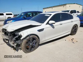 2015 BMW M5 z VIN WBSFV9C54FD594450, wystawiony jako Copart lot #52173915 z przebiegiem 67 267 mil mil oraz Szkoda całkowita • Salvage title. Historia ofert i sprzedaży dostępna na DreamBid. Obrazek 1.