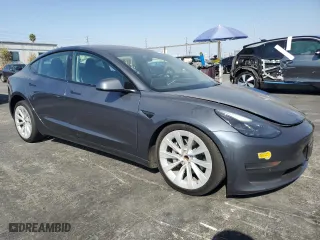 2022 Tesla Model 3 with VIN 5YJ3E1EA1NF372879, listed as a Copart auction lot 71604604 with 60,925 mi miles and Salvage Title. Bid and sale history available at carsss.com. Image 4.