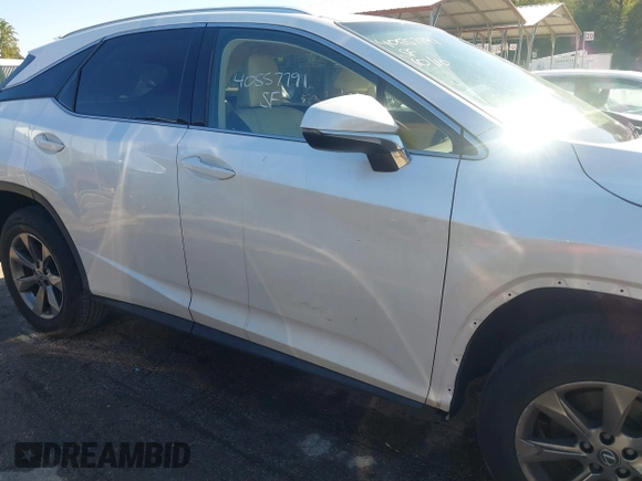2019 Lexus RX with VIN JTJBZMCA0K2041369, listed as a IAAI auction lot 40557791 with 51,524 mi miles. Bid and sale history available at carsss.com. Image 17.