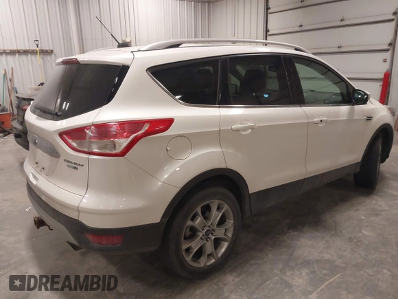 2014 Ford Escape Titanium with VIN 1FMCU9J9XEUE26857, listed as a IAAI auction lot 41552186 with 142,045 mi miles. Bid and sale history available at carsss.com. Image 4.