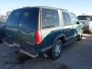1997 GMC Yukon with VIN 1GKEK13R1VJ723409, listed as a IAAI auction lot 41512184 with 235,988 mi miles. Bid and sale history available at carsss.com. Image 4.