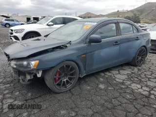 2014 Mitsubishi Lancer Evolution GSR z VIN JA32W8FV1EU023827, wystawiony jako Copart lot #55707575 z przebiegiem 4290 mil mil oraz Szkody całkowita. Historia ofert i sprzedaży dostępna na DreamBid. Obrazek 1.