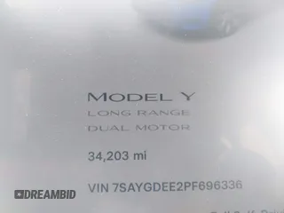 2023 Tesla Model Y Long Range with VIN 7SAYGDEE2PF696336, listed as a IAAI auction lot 41894686 with 34,203 mi miles. Bid and sale history available at carsss.com. Image 7.