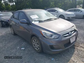 2013 Hyundai Accent GLS z VIN KMHCT4AEXDU502319, wystawiony jako IAAI lot #42423517 z przebiegiem 228 402 mil mil oraz . Historia ofert i sprzedaży dostępna na DreamBid. Obrazek 1.