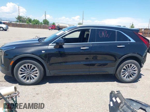 2024 Cadillac XT4 AWD Premium Luxury z VIN 1GYFZDR44RF144801, wystawiony jako IAAI lot #42646613 z przebiegiem 37 358 mil mil oraz . Historia ofert i sprzedaży dostępna na DreamBid. Obrazek 15.