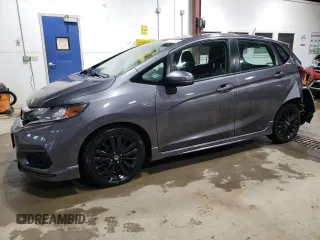 2018 Honda Fit Sport z VIN 3HGGK5H69JM716278, wystawiony jako Copart lot #61002005 z przebiegiem 82 929 mil mil oraz Szkoda całkowita • Salvage title. Historia ofert i sprzedaży dostępna na DreamBid. Obrazek 1.