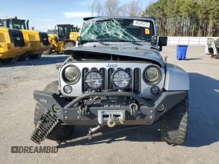 2015 Jeep Wrangler Unlimited Wrangler X with VIN 1C4BJWEG7FL580885, listed as a Copart auction lot 48891605 with 104,448 mi miles and Salvage title. Bid and sale history available at DreamBid. Image 5.