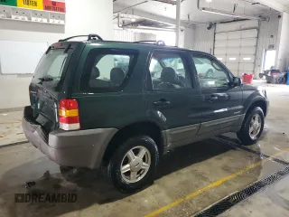 2002 Ford Escape XLS Value with VIN 1FMYU01B32KC48043, listed as a Copart auction lot 63011005 with 167,185 mi miles and Salvage title. Bid and sale history available at DreamBid. Image 3.