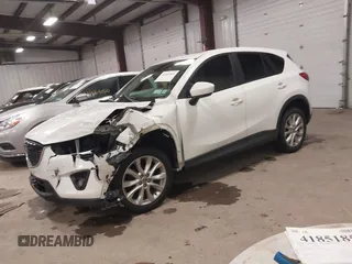 2014 Mazda CX-5 Grand Touring with VIN JM3KE4DY3E0374036, listed as a IAAI auction lot 41889030 with 162,611 mi miles and . Bid and sale history available at DreamBid. Image 2.