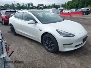 2019 Tesla Model 3 Mid Range z VIN 5YJ3E1EA7KF299755, wystawiony jako IAAI lot #42354352 z przebiegiem Nie podano mil oraz . Historia ofert i sprzedaży dostępna na DreamBid. Obrazek 1.
