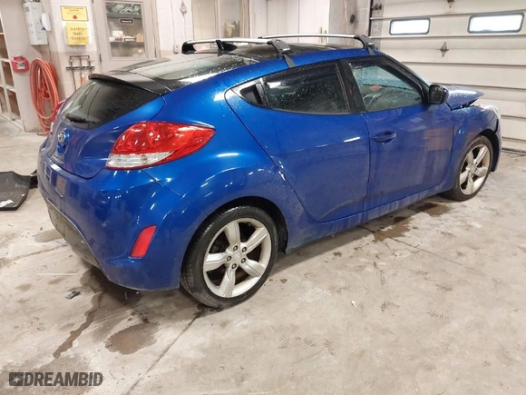 2014 Hyundai Veloster with VIN KMHTC6AD4EU196870, listed as a IAAI auction lot 41207663 with 119,252 mi miles. Bid and sale history available at carsss.com. Image 4.