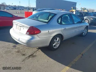 2003 Ford Taurus SE Standard with VIN 1FAFP53U23A245453, listed as a IAAI auction lot 41680402 with 96,761 mi miles. Bid and sale history available at carsss.com. Image 4.