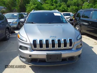 2014 Jeep Cherokee Latitude with VIN 1C4PJMCB4EW315520, listed as a IAAI auction lot 42034989 with 215,758 mi miles and . Bid and sale history available at DreamBid. Image 12.