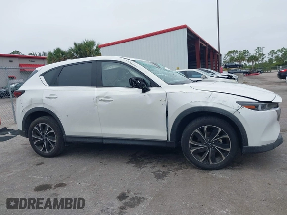 2023 Mazda CX-5 2.5 S Premium Package with VIN JM3KFBDM1P0126787, listed as a IAAI auction lot 41164586 with 12,076 mi miles. Bid and sale history available at carsss.com. Image 13.